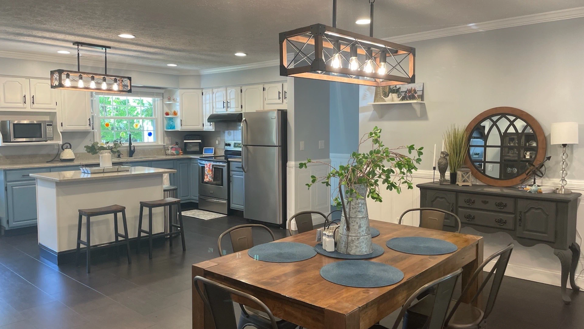 lighting installed in a open kitchen and dining table of residential house